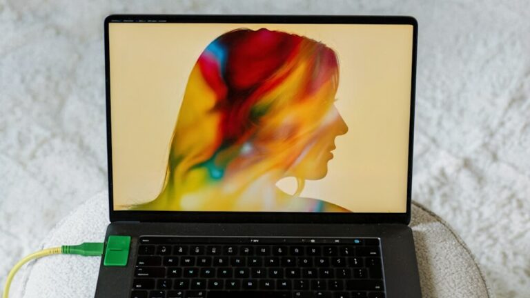 Laptop screen showing artistic female profile