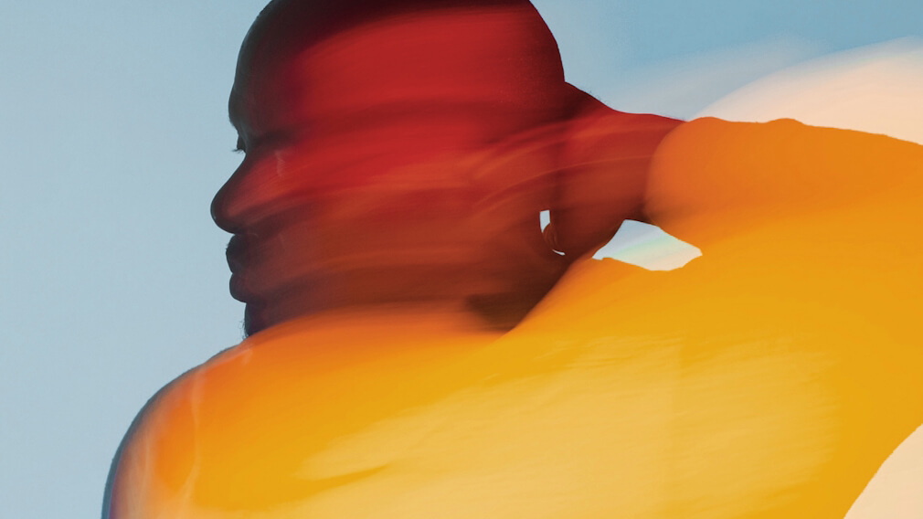 Figure posing with artistic effect on a blue background