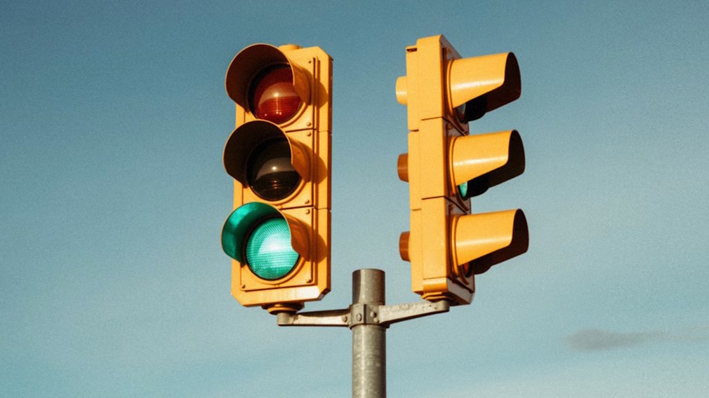 Yellow traffic lights with clear blue sky background