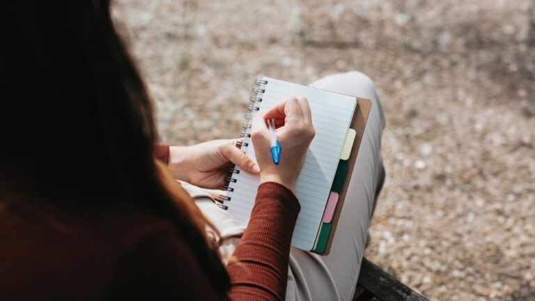 Woman writing in journal