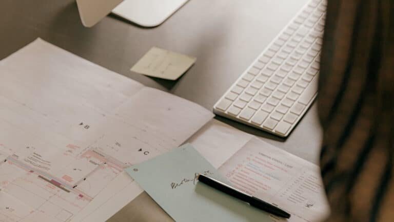 Computer and plans on a desktop